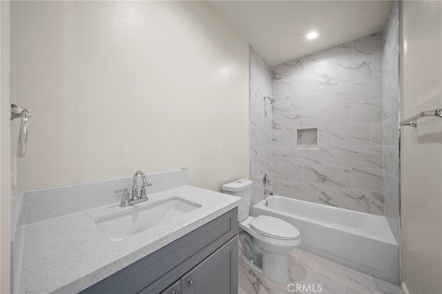 full bathroom with toilet, marble finish floor, washtub / shower combination, and vanity