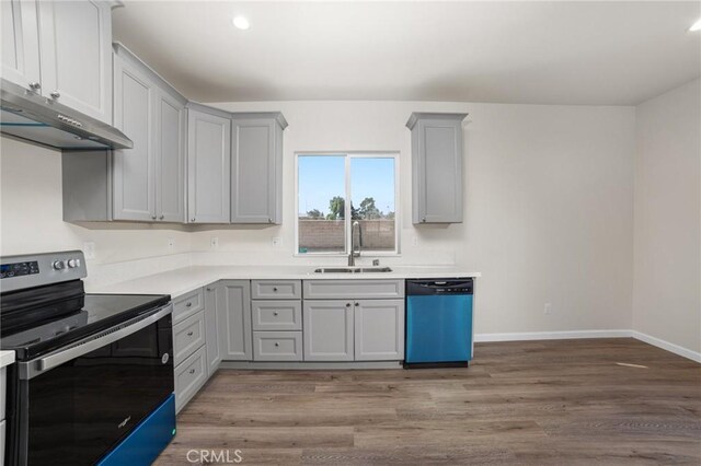 kitchen featuring dishwashing machine, gray cabinetry, and stainless steel electric range
