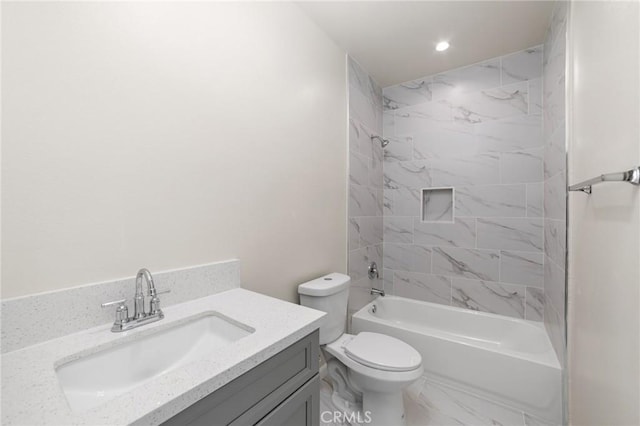 bathroom featuring marble finish floor, recessed lighting, toilet, washtub / shower combination, and vanity
