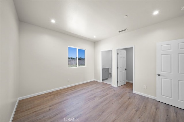 unfurnished bedroom featuring recessed lighting, baseboards, visible vents, and light wood finished floors