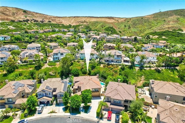 bird's eye view featuring a residential view and a mountain view