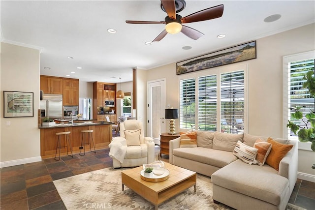 living room with a wealth of natural light and crown molding