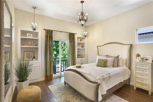 bedroom with a chandelier, access to outside, and dark wood-style floors