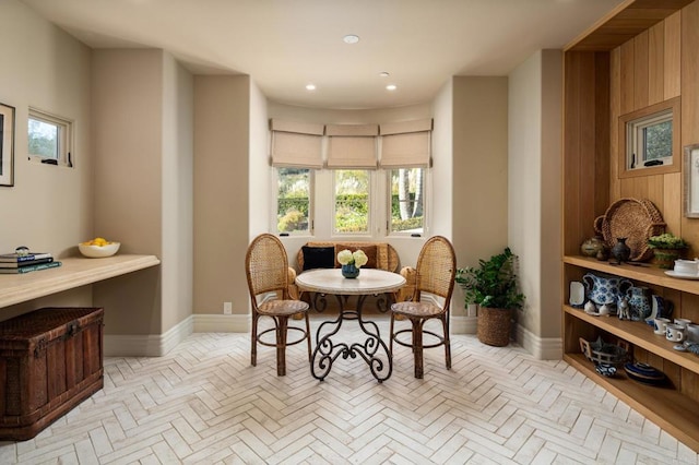 living area with recessed lighting and baseboards
