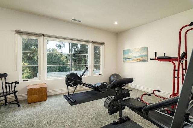 workout room featuring recessed lighting, carpet floors, a healthy amount of sunlight, and baseboards