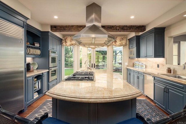 kitchen with open shelves, island range hood, a sink, dark wood-type flooring, and appliances with stainless steel finishes