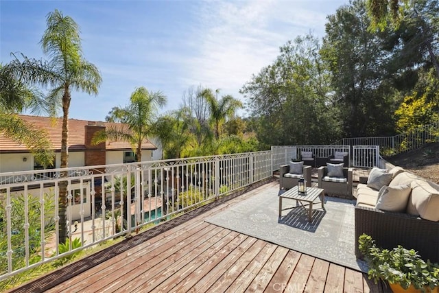 wooden terrace featuring an outdoor living space