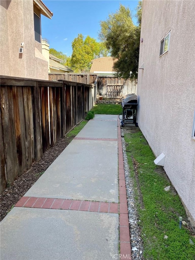 exterior space featuring a patio area and a fenced backyard