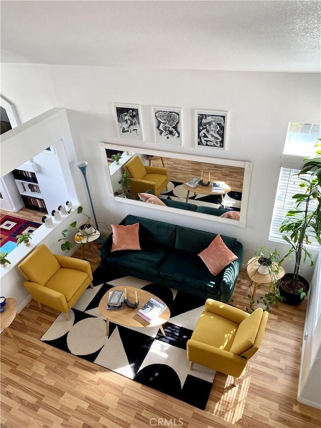 interior space featuring a textured ceiling and wood finished floors