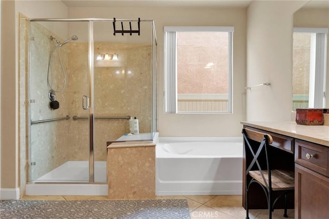 full bathroom featuring a garden tub, a shower stall, vanity, and tile patterned floors