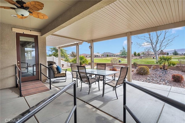 view of patio with ceiling fan and outdoor dining area