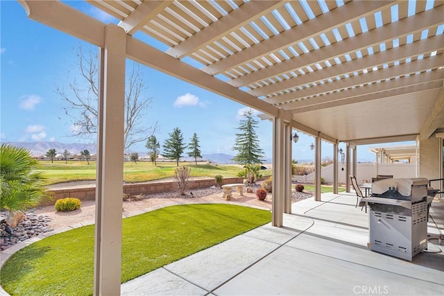 view of patio / terrace with a pergola, a grill, fence, and a mountain view