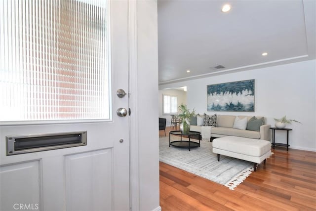 foyer entrance featuring recessed lighting, visible vents, and wood finished floors