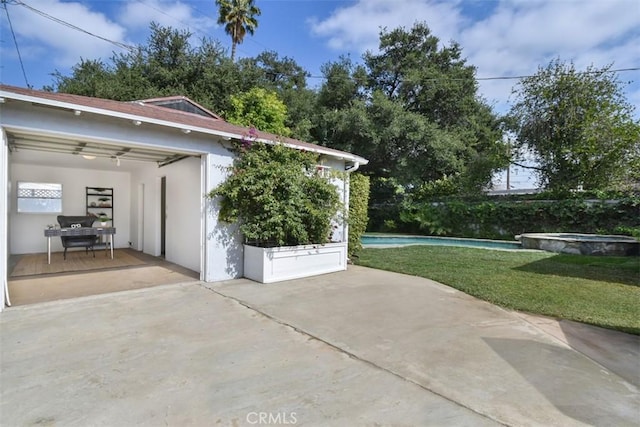 exterior space with a pool with connected hot tub