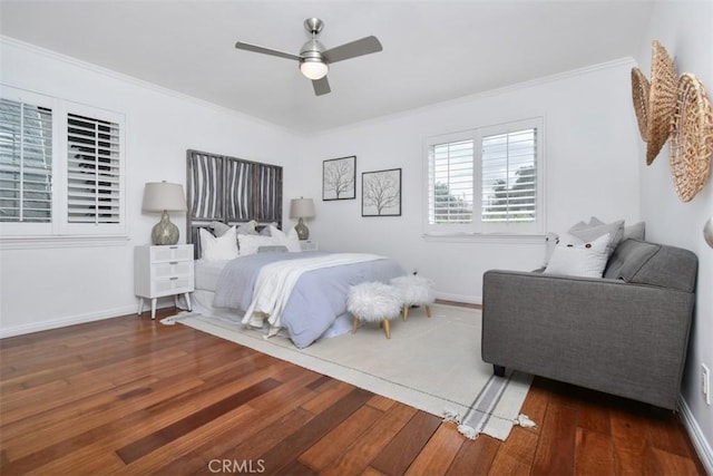 bedroom with ornamental molding and hardwood / wood-style flooring