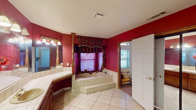 bathroom with two vanities, visible vents, a sink, and tile patterned floors