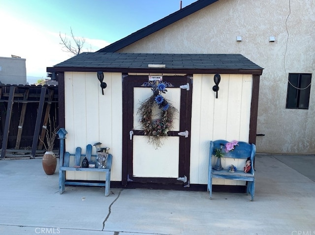 view of outdoor structure with an outdoor structure and fence