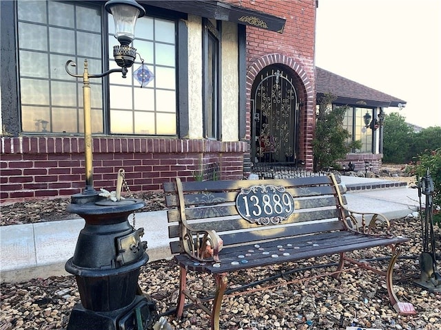 property entrance with brick siding