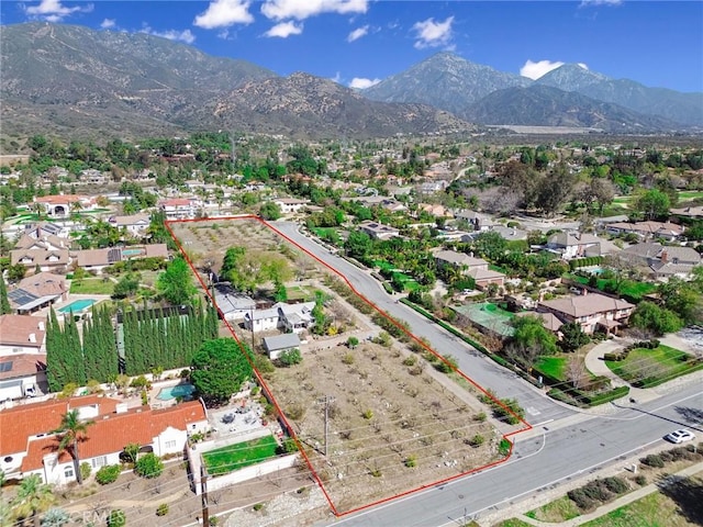 drone / aerial view featuring a mountain view and a residential view