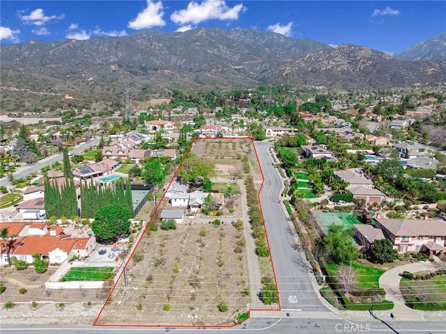 drone / aerial view with a residential view and a mountain view