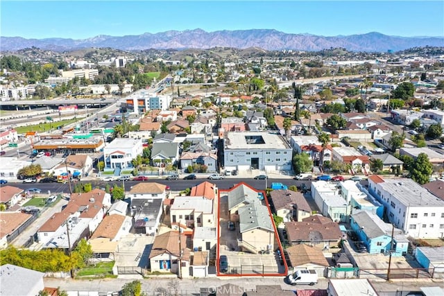 birds eye view of property with a residential view and a mountain view