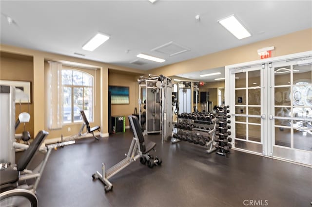 exercise room featuring baseboards