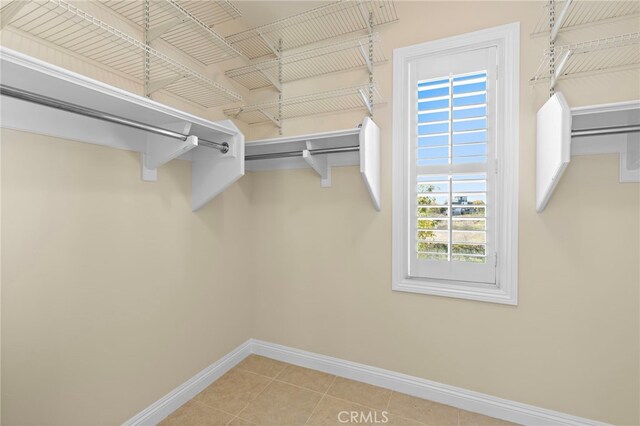 walk in closet featuring tile patterned flooring