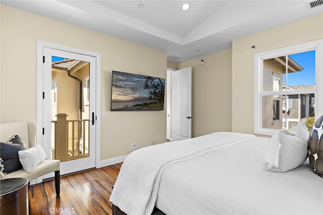 bedroom with baseboards, visible vents, dark wood finished floors, lofted ceiling, and recessed lighting