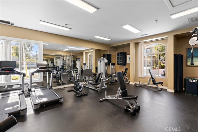 gym featuring visible vents and baseboards