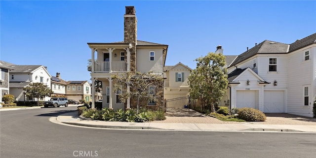 view of front of property featuring decorative driveway and a residential view