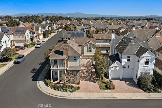 drone / aerial view with a mountain view and a residential view