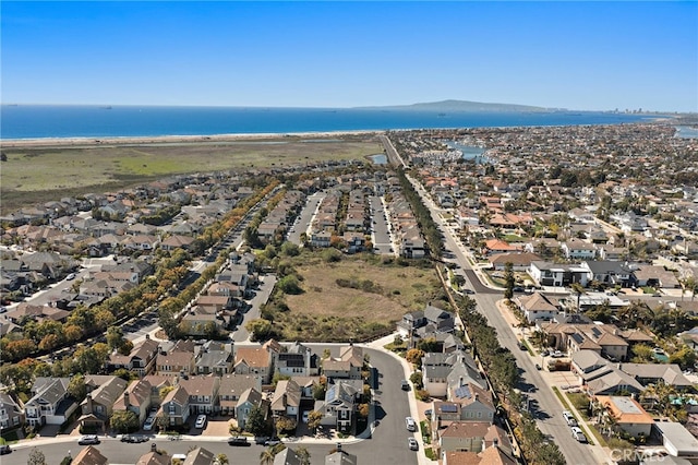 birds eye view of property featuring a residential view and a water view