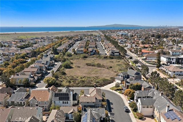 aerial view featuring a residential view and a water view