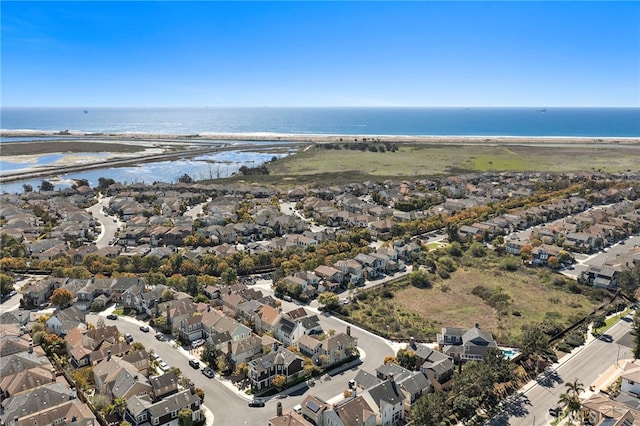 birds eye view of property featuring a residential view and a water view