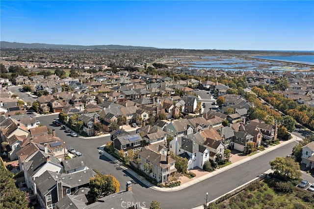 aerial view featuring a residential view and a water view