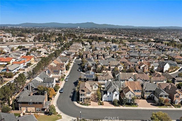 drone / aerial view featuring a mountain view and a residential view