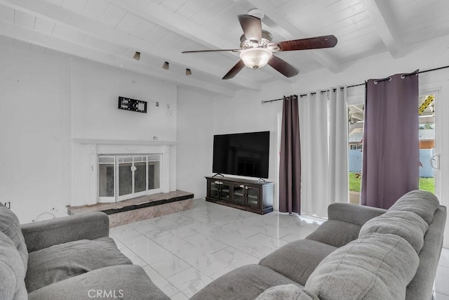 living room featuring a ceiling fan, a glass covered fireplace, wood ceiling, beamed ceiling, and marble finish floor