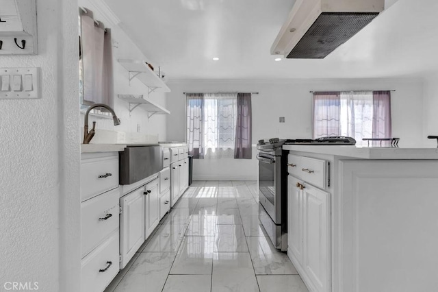 kitchen with marble finish floor, open shelves, stainless steel electric range, and a wealth of natural light