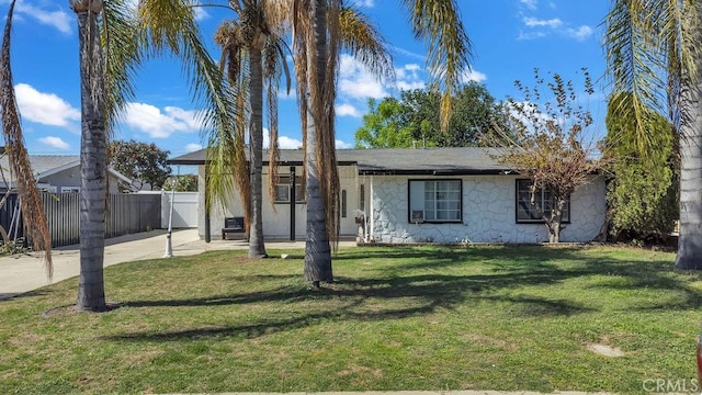 single story home with a gate, fence, and a front lawn