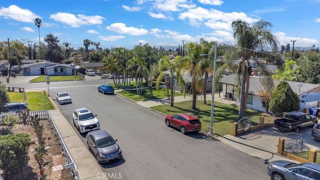 view of street featuring a residential view, curbs, and sidewalks