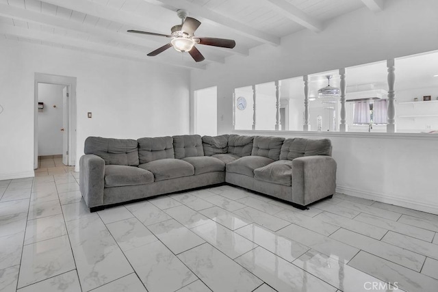 living area featuring beam ceiling, marble finish floor, a ceiling fan, wooden ceiling, and baseboards