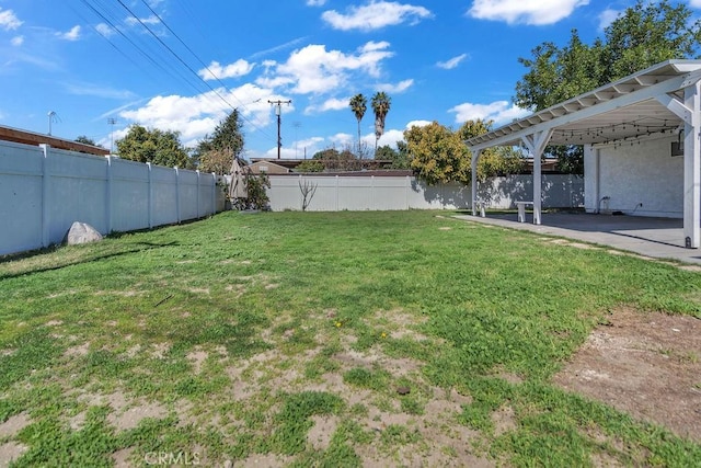 view of yard featuring a patio area, a fenced backyard, and a pergola