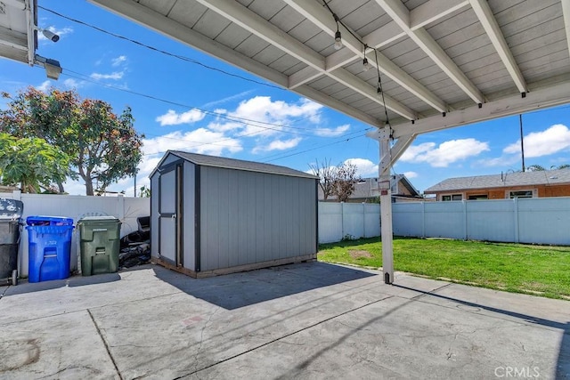 view of patio with a fenced backyard, a storage unit, and an outdoor structure