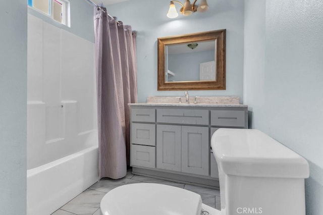 full bath featuring marble finish floor, vanity, toilet, and shower / tub combo with curtain