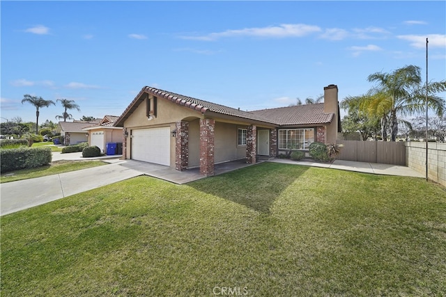 ranch-style home with an attached garage, fence, driveway, stucco siding, and a front yard