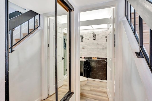 interior space with wood finished floors and stairs