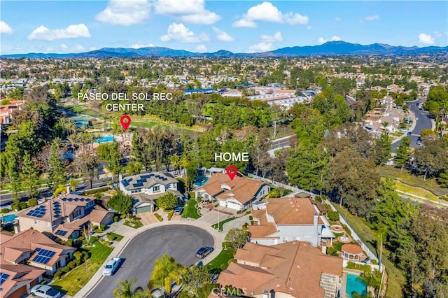 drone / aerial view with a residential view and a mountain view