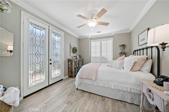 bedroom featuring access to outside, french doors, light wood-type flooring, and crown molding