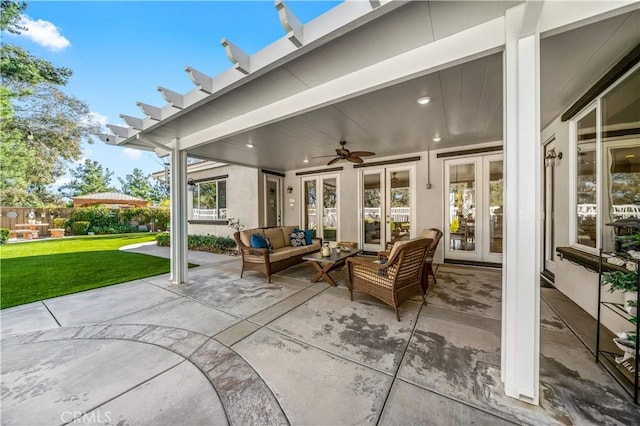 view of patio / terrace featuring french doors, ceiling fan, and an outdoor living space