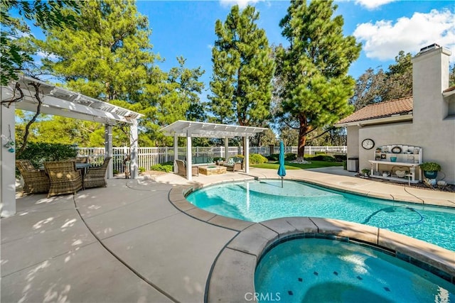 view of swimming pool with an in ground hot tub, a patio area, a fenced in pool, and a pergola